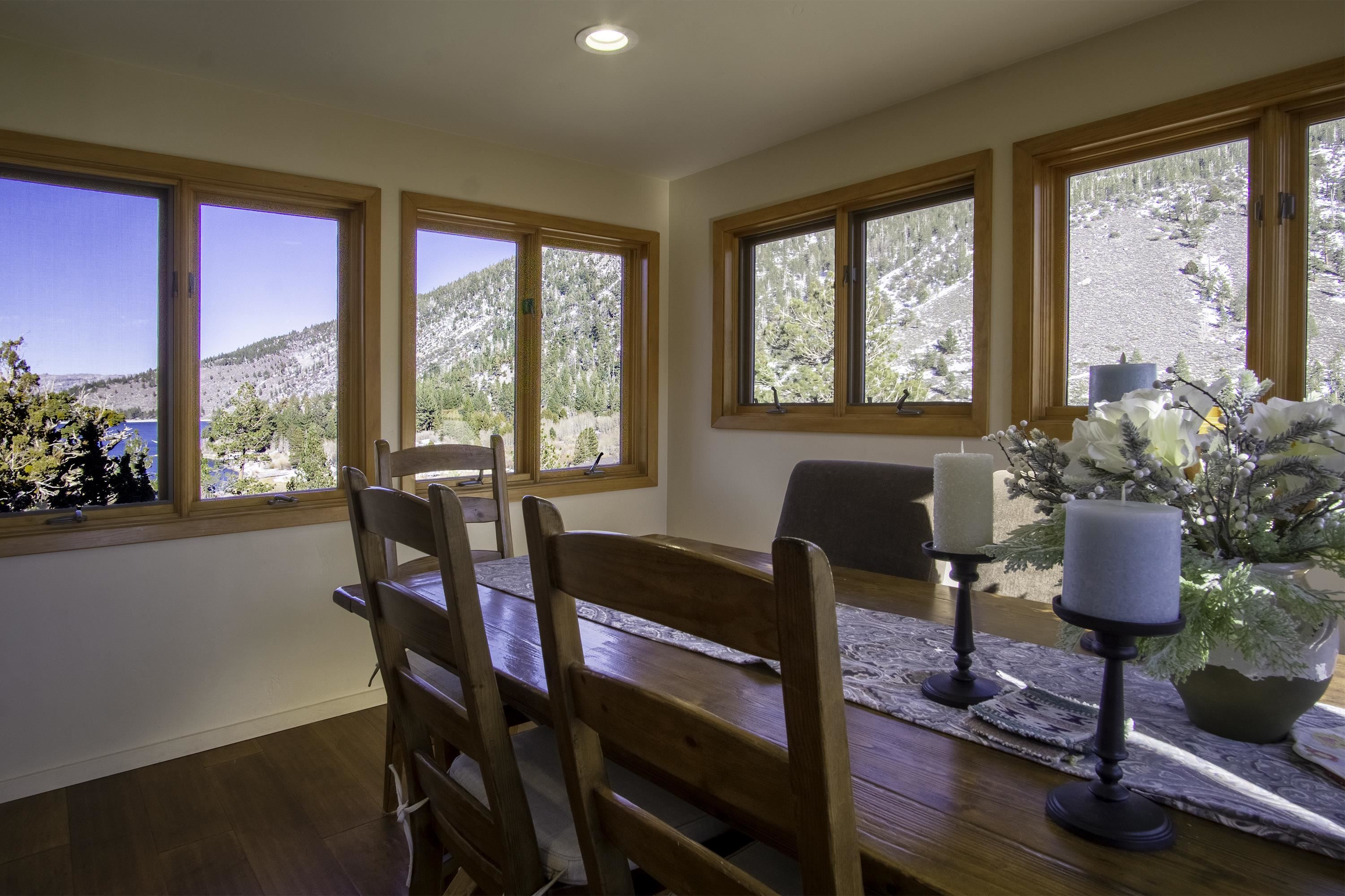 214 Skyline Road June Lake, CA 93529 - Photo 13 of 39 a view of a dining room with furniture window and outside view