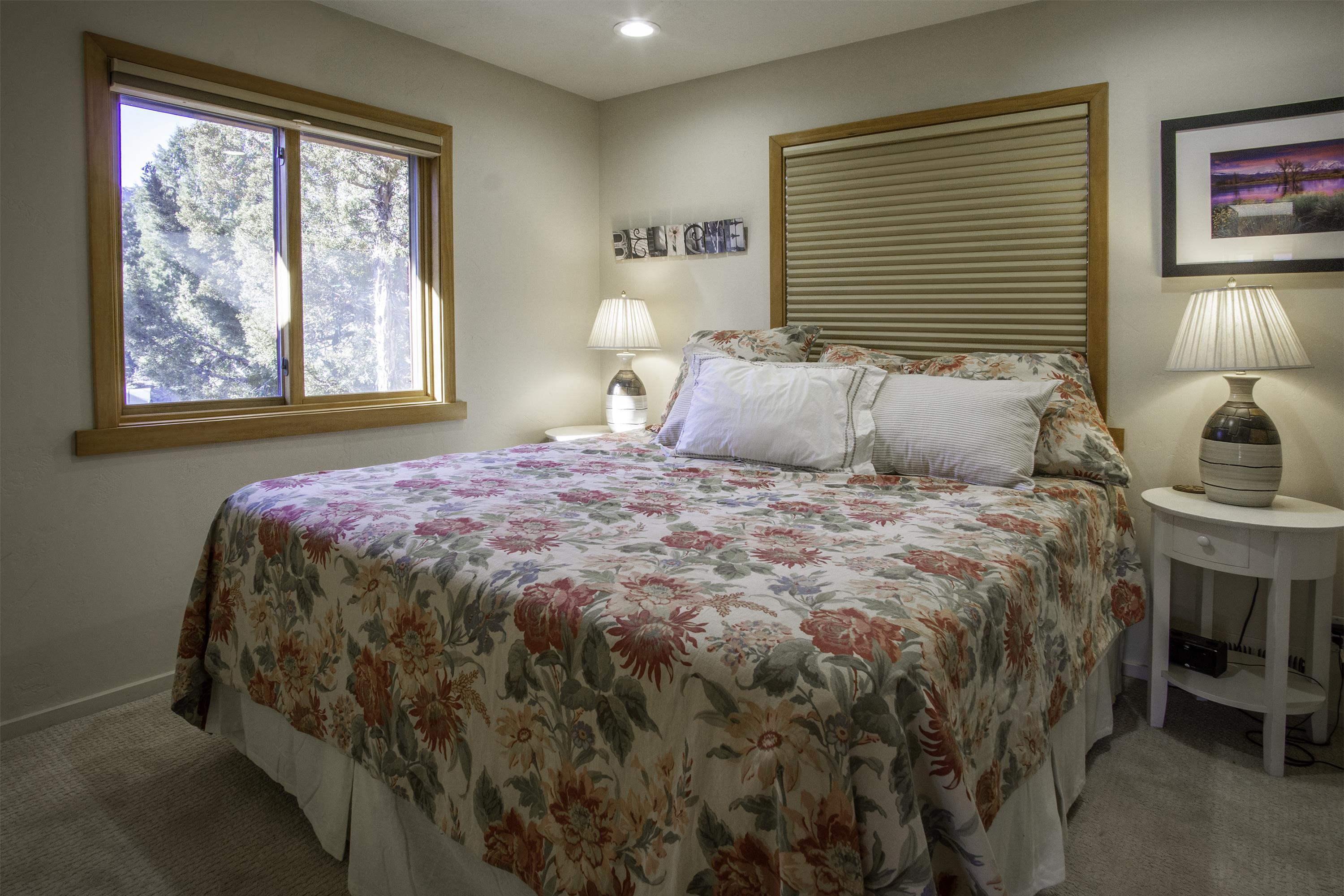 214 Skyline Road June Lake, CA 93529 - Photo 20 of 39 a bedroom with a bed and a window