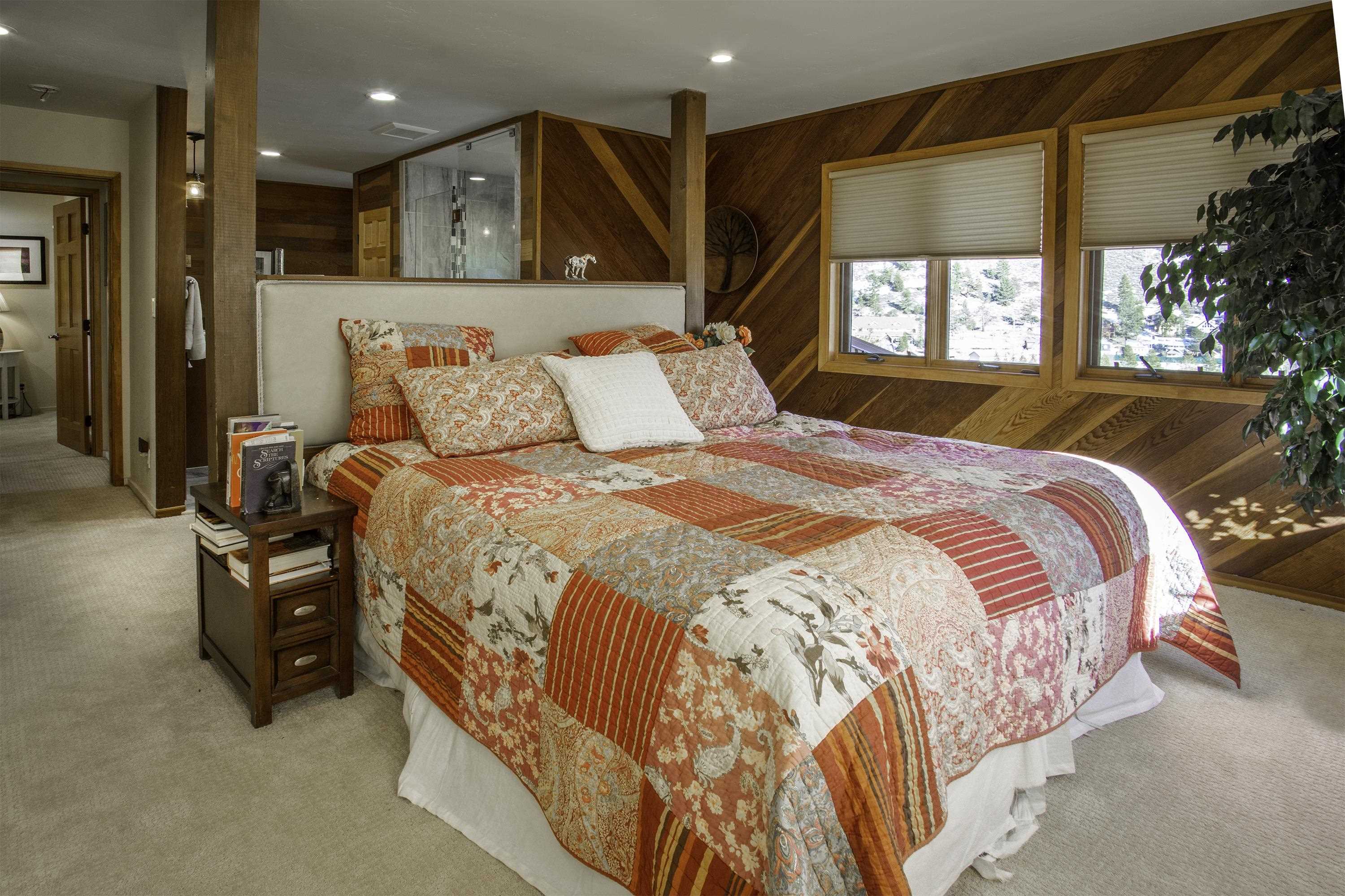 214 Skyline Road June Lake, CA 93529 - Photo 25 of 39 a large bed sitting in a bedroom next to a window