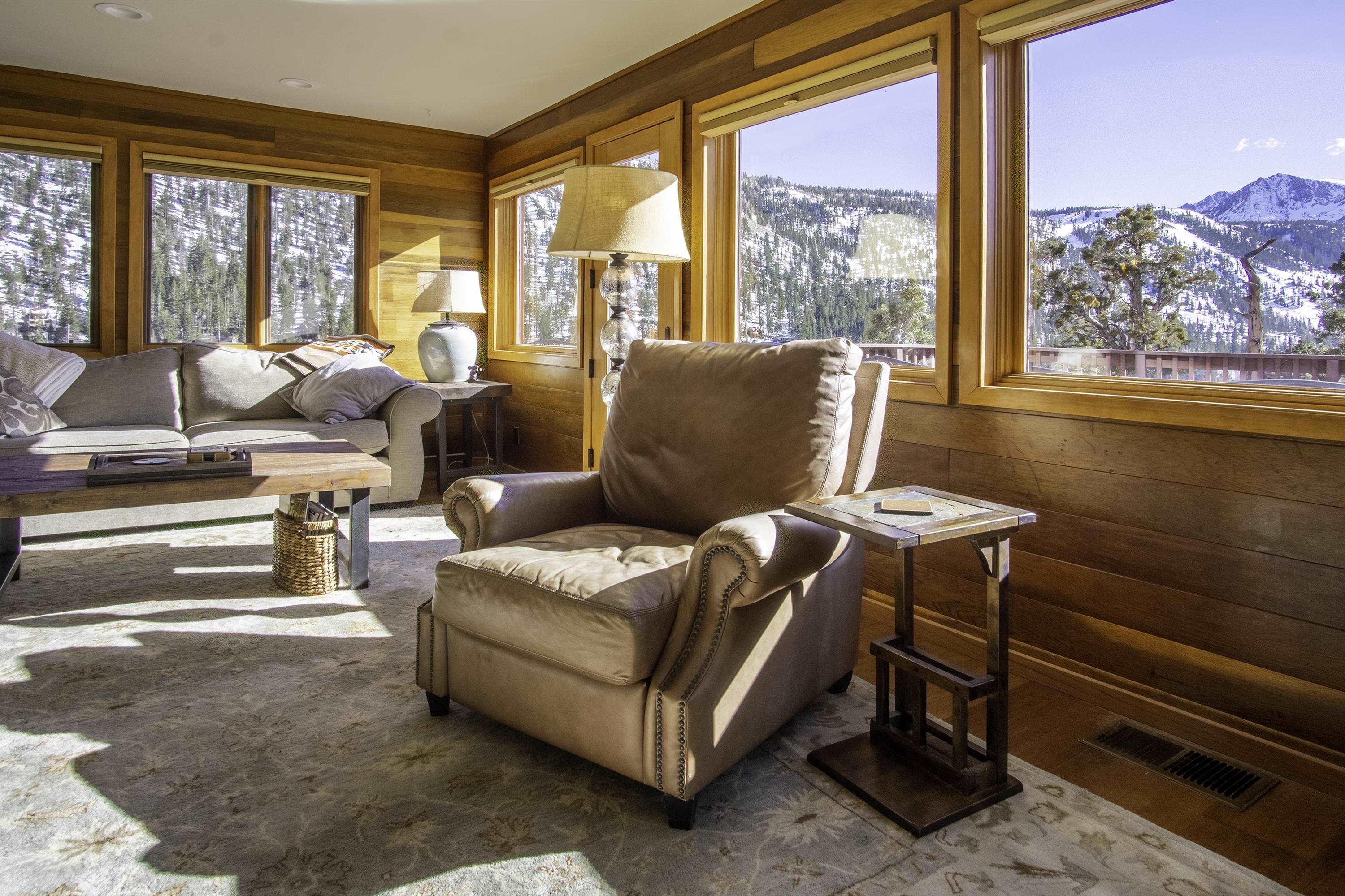 214 Skyline Road June Lake, CA 93529 - Photo 3 of 39 a living room with furniture and a floor to ceiling window