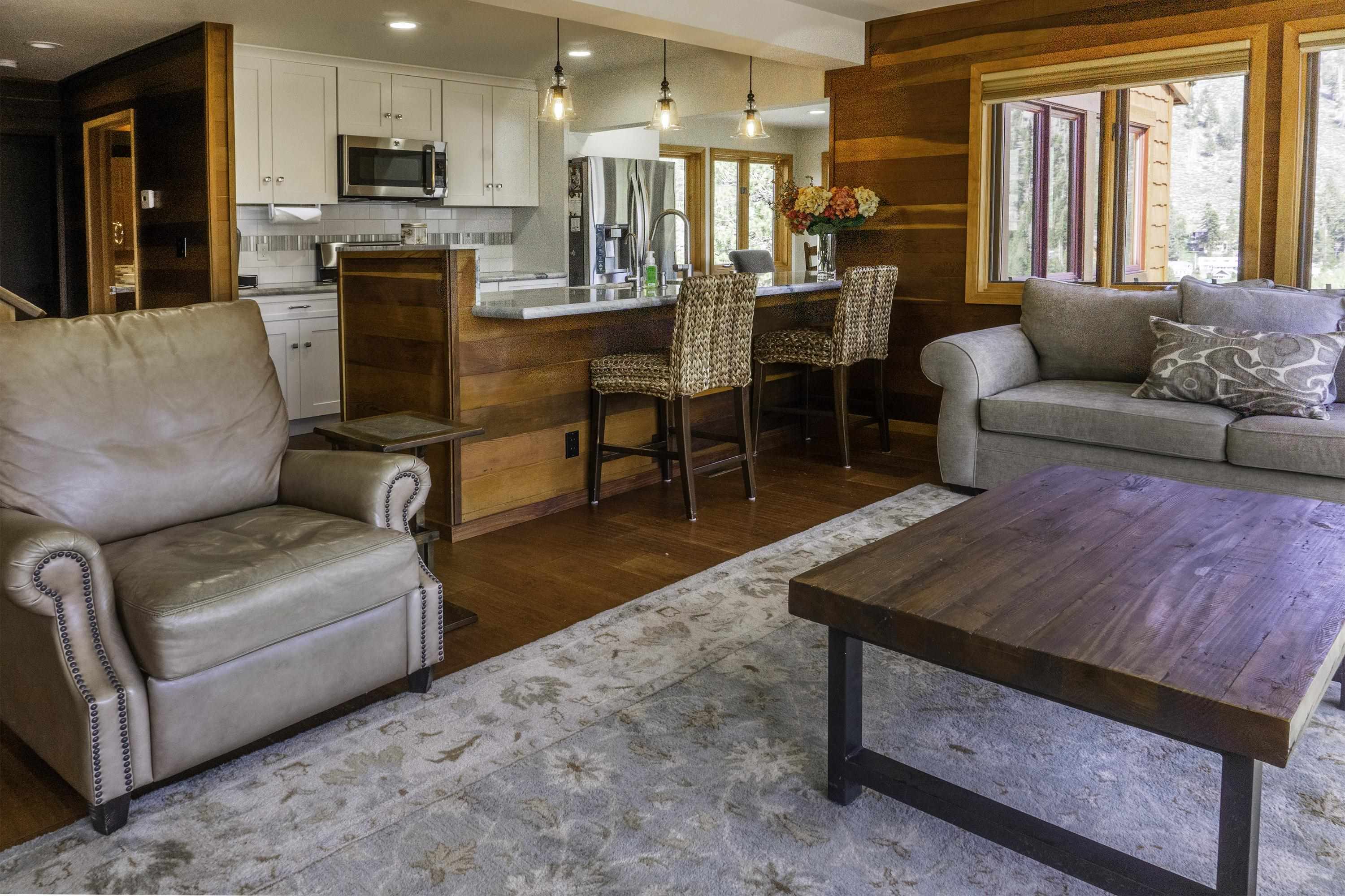 214 Skyline Road June Lake, CA 93529 - Photo 6 of 39 a living room with furniture wooden floor and kitchen view