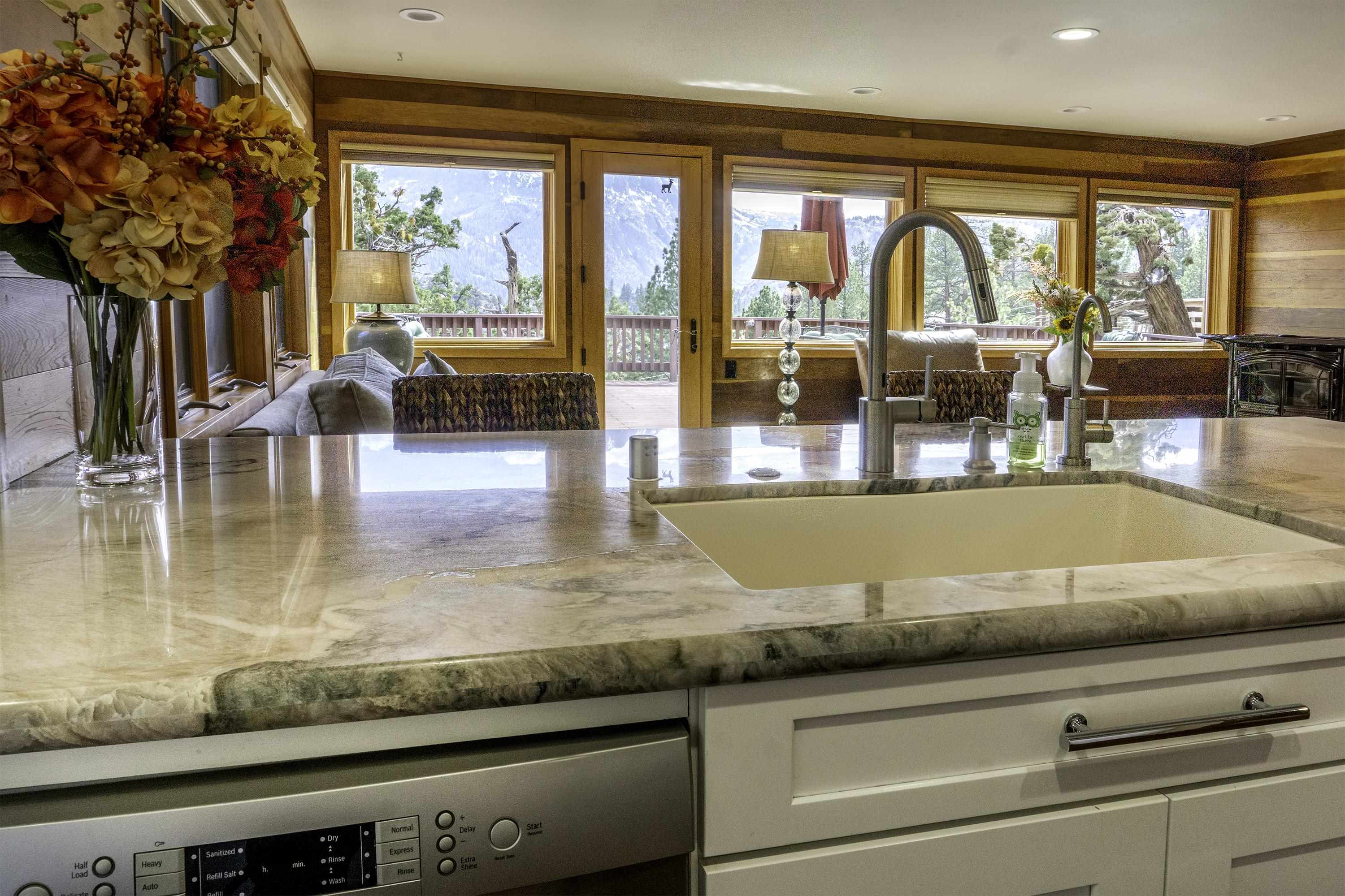 214 Skyline Road June Lake, CA 93529 - Photo 8 of 39 a view of a kitchen counter top and living room