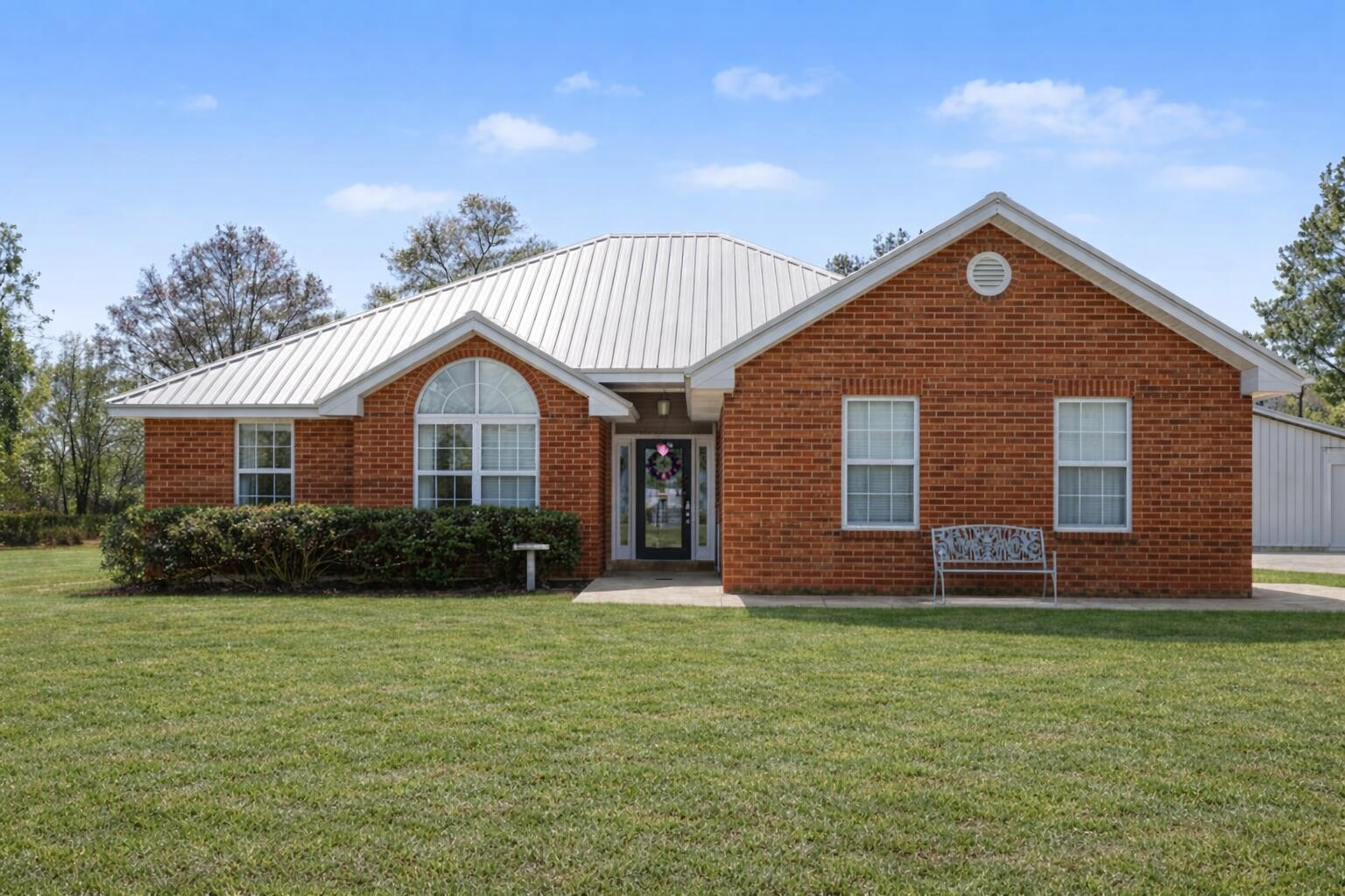 a front view of a house with a yard