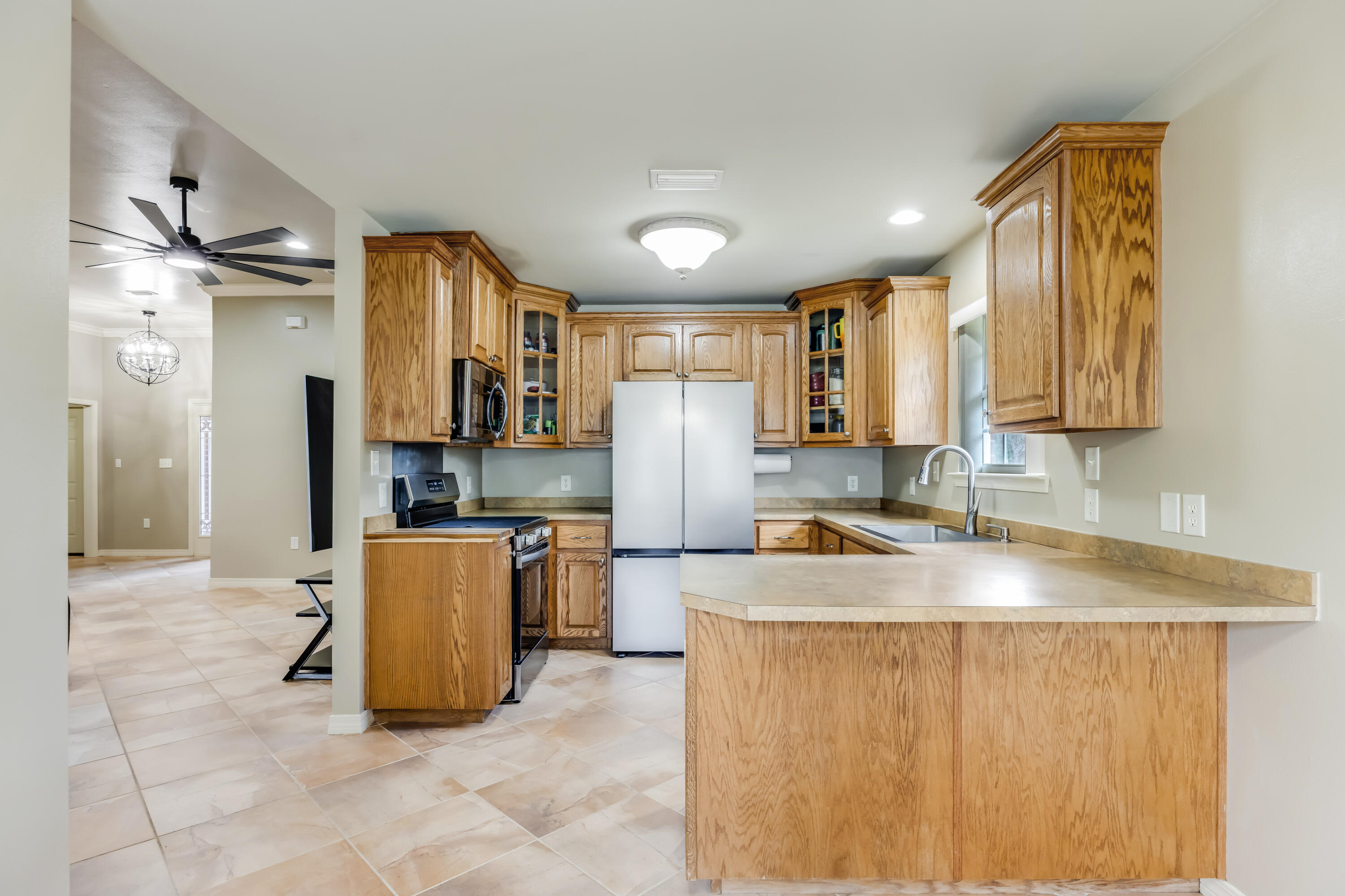 1582 Greenwood Road Baker, FL 32531 - Photo 11 of 49 a kitchen with stainless steel appliances granite countertop a sink a stove and a refrigerator