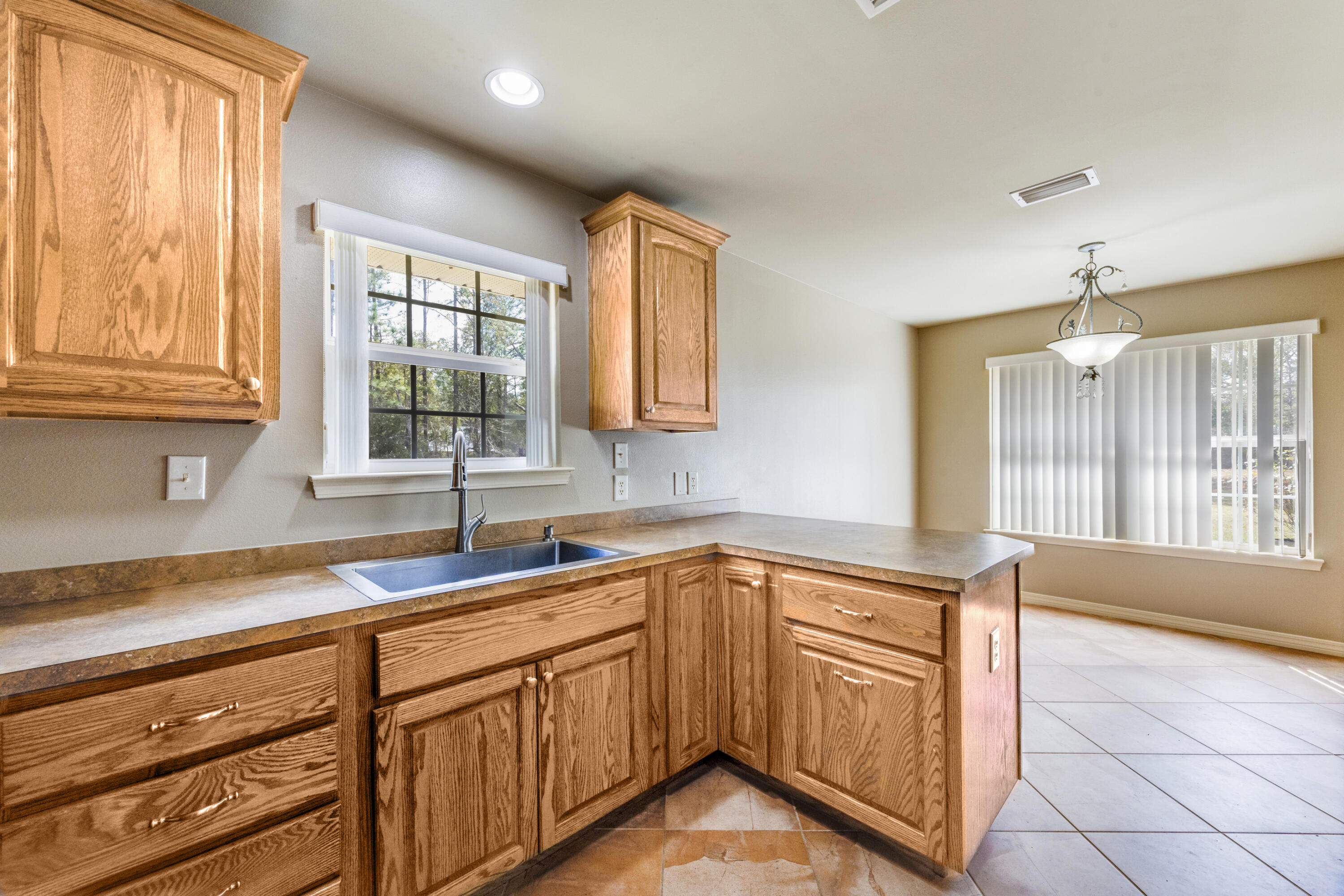 1582 Greenwood Road Baker, FL 32531 - Photo 13 of 49 a kitchen with a sink and cabinets