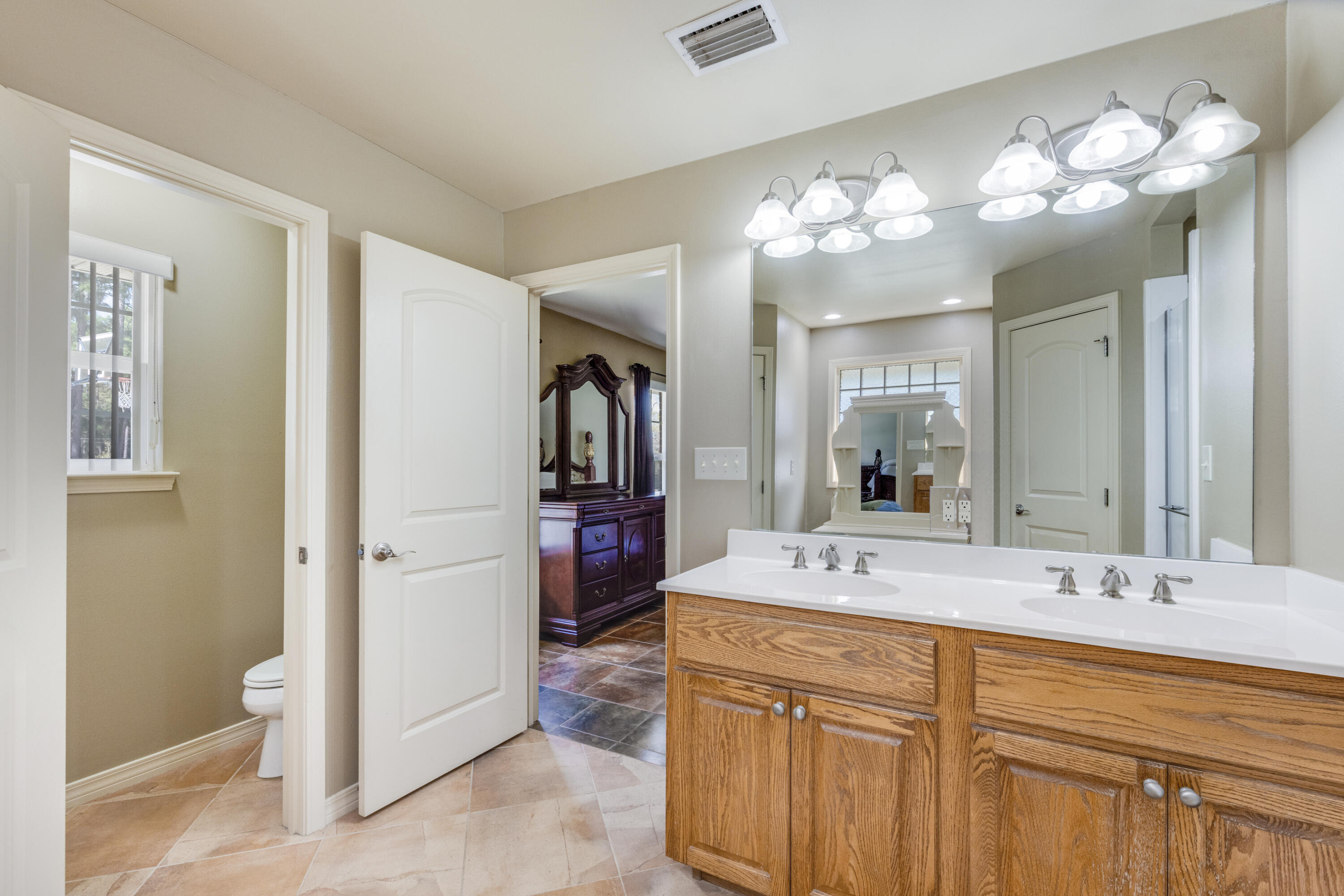 1582 Greenwood Road Baker, FL 32531 - Photo 19 of 49 a bathroom with a sink vanity and a mirror