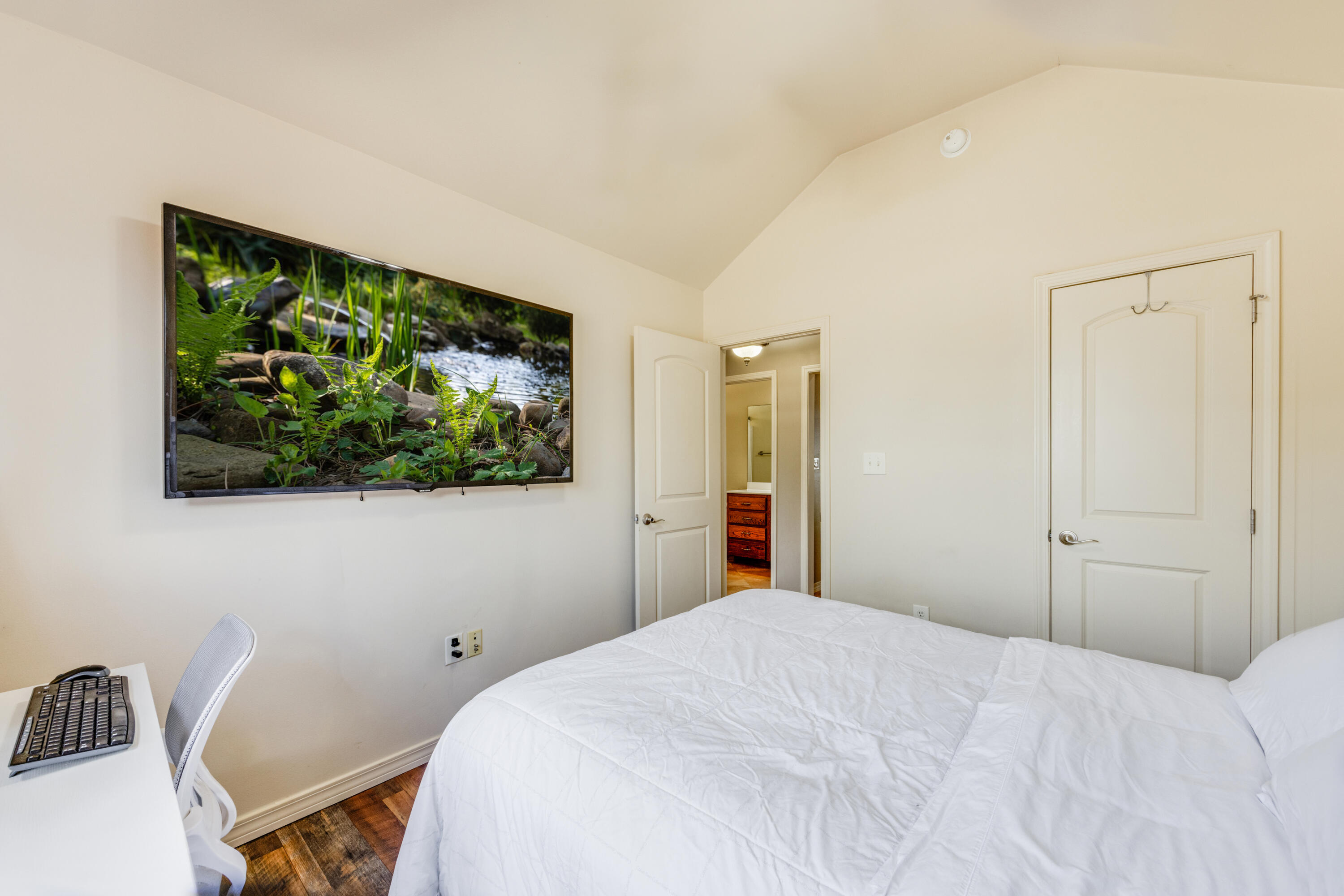 1582 Greenwood Road Baker, FL 32531 - Photo 23 of 49 a bedroom with a bed and a flat screen tv