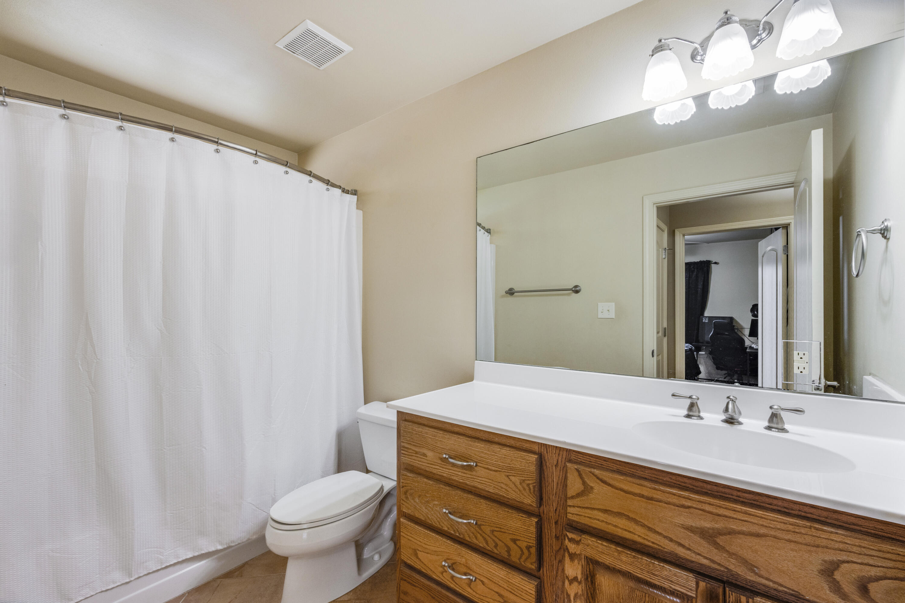 1582 Greenwood Road Baker, FL 32531 - Photo 25 of 49 a bathroom with a double vanity sink and a mirror