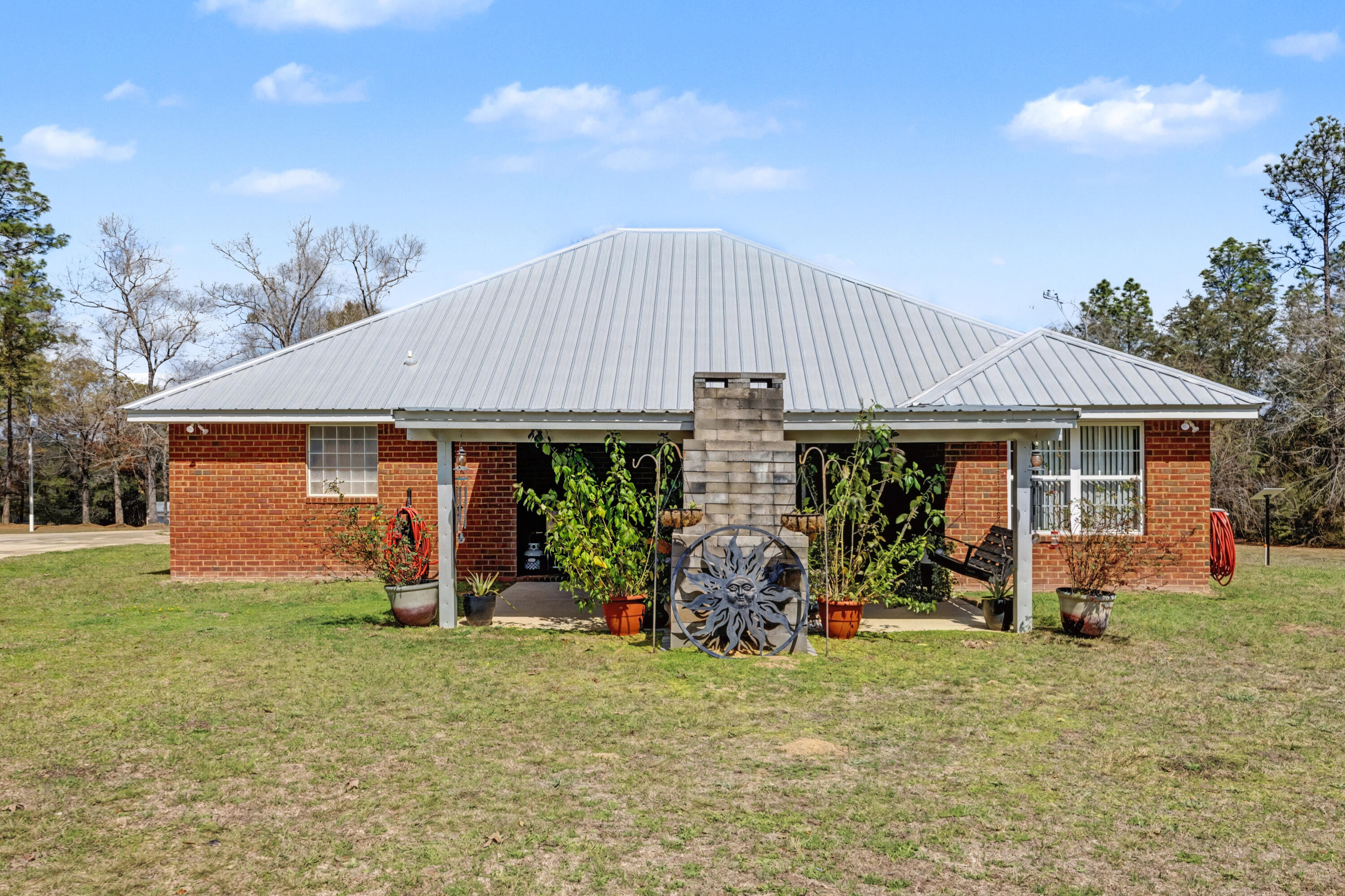 1582 Greenwood Road Baker, FL 32531 - Photo 31 of 49 a front view of a house with garden