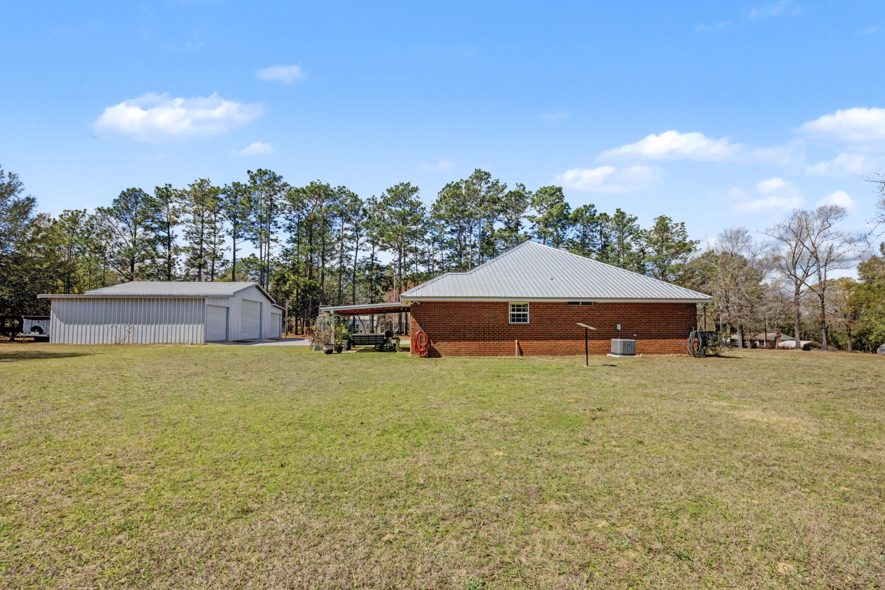 1582 Greenwood Road Baker, FL 32531 - Photo 32 of 49 a house with trees in the background