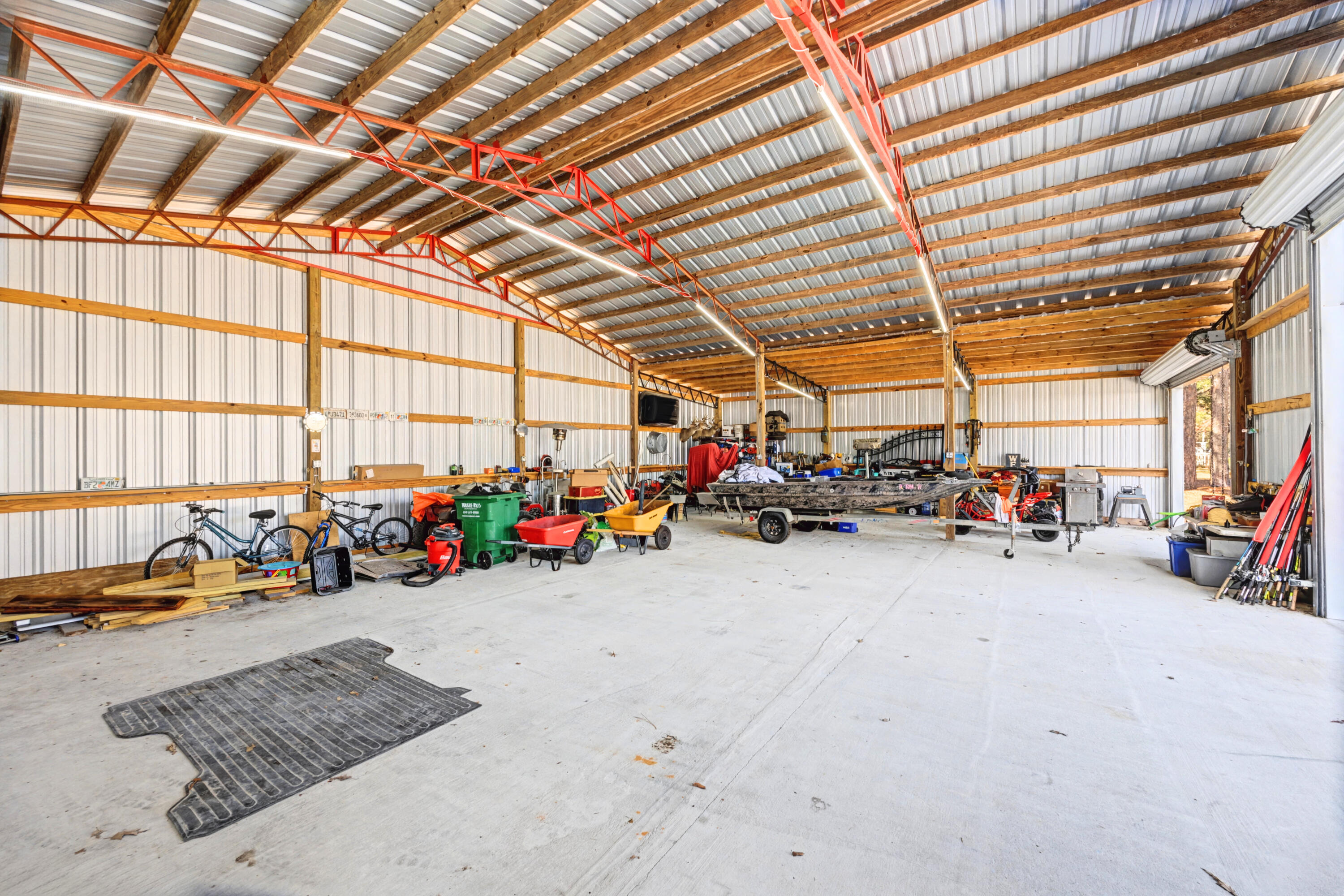 1582 Greenwood Road Baker, FL 32531 - Photo 37 of 49 a view of a garage with a bike and wooden roof