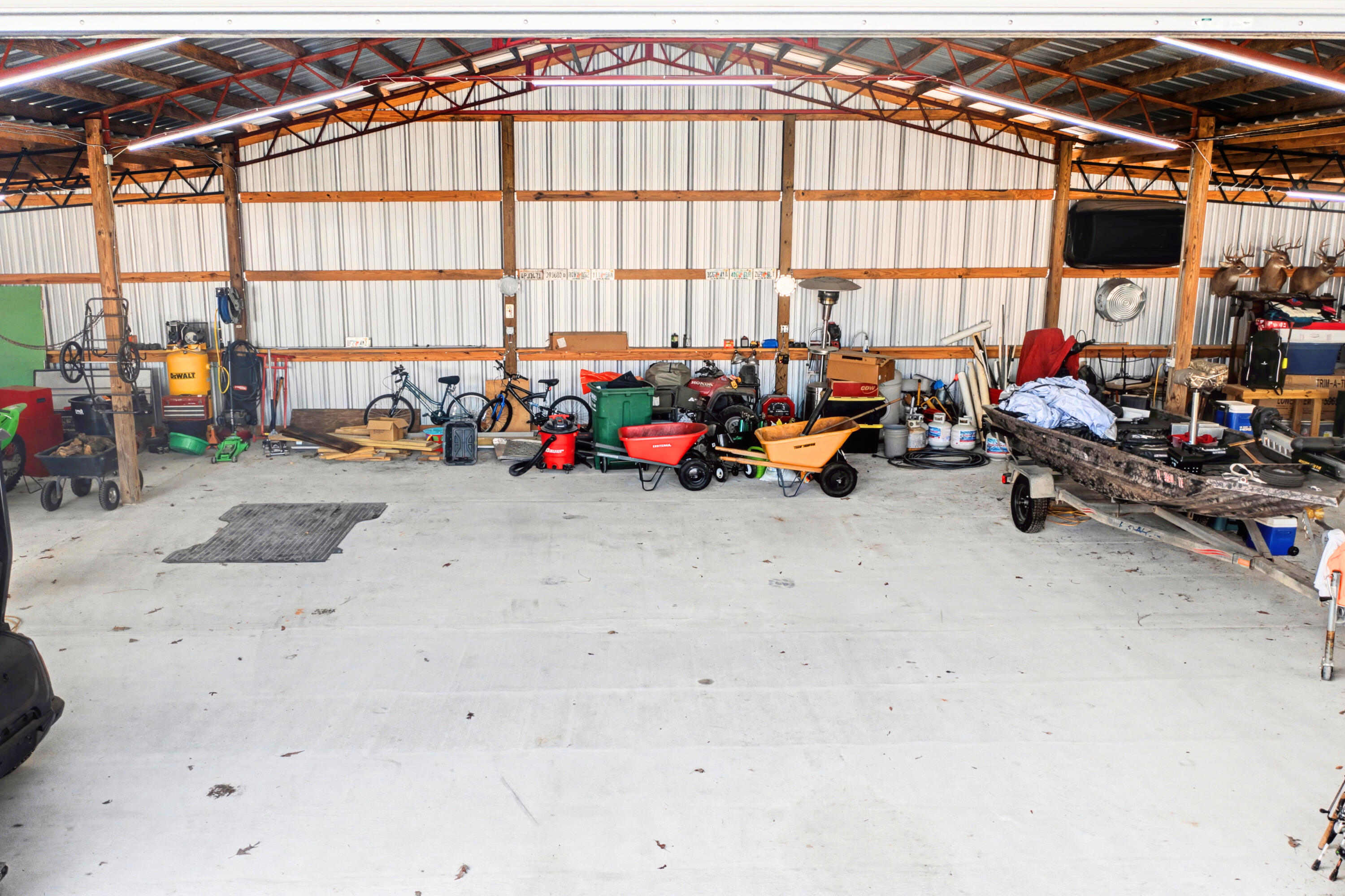 1582 Greenwood Road Baker, FL 32531 - Photo 38 of 49 a view of a garage with a bike and a car