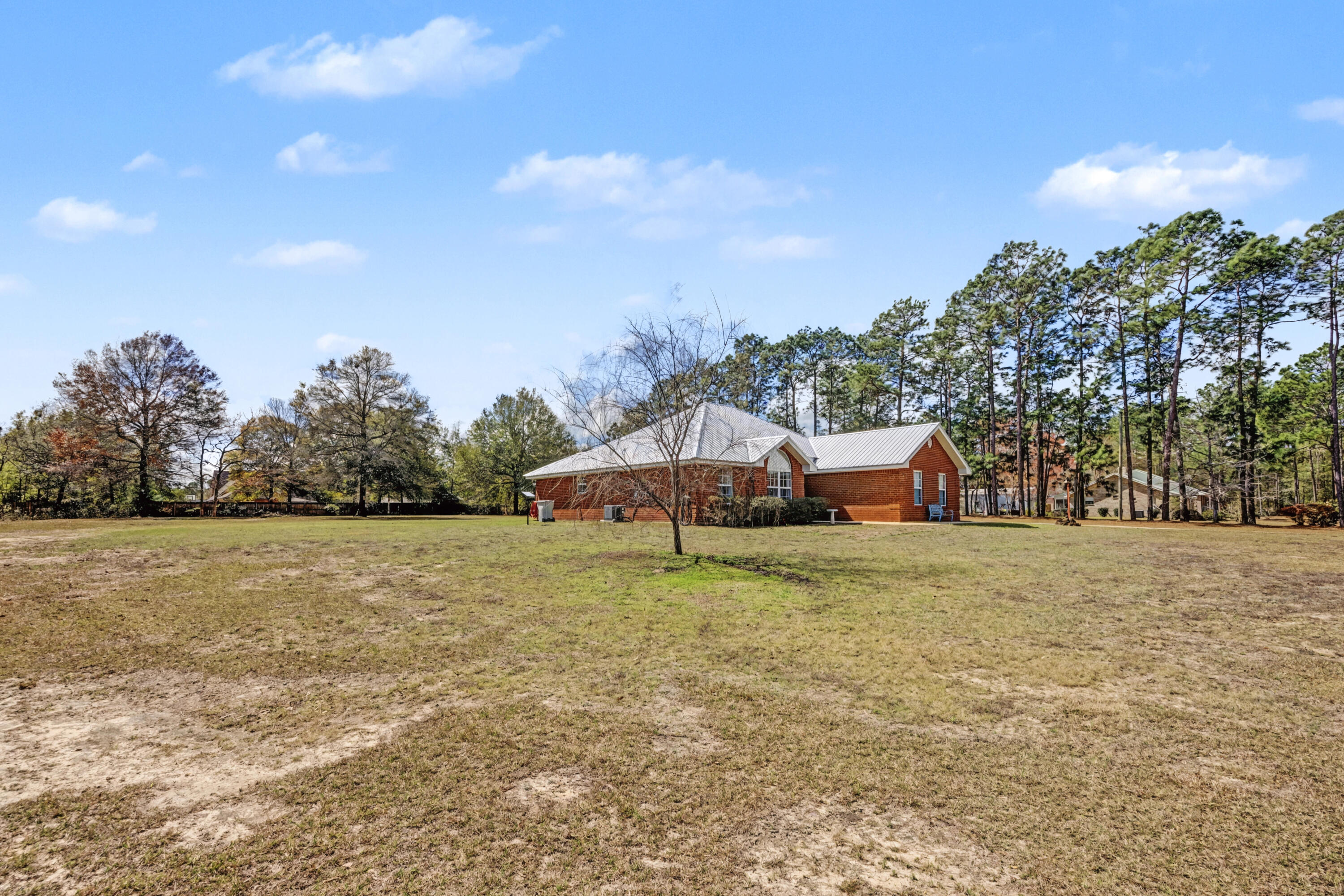 1582 Greenwood Road Baker, FL 32531 - Photo 39 of 49 a house with trees in front of it