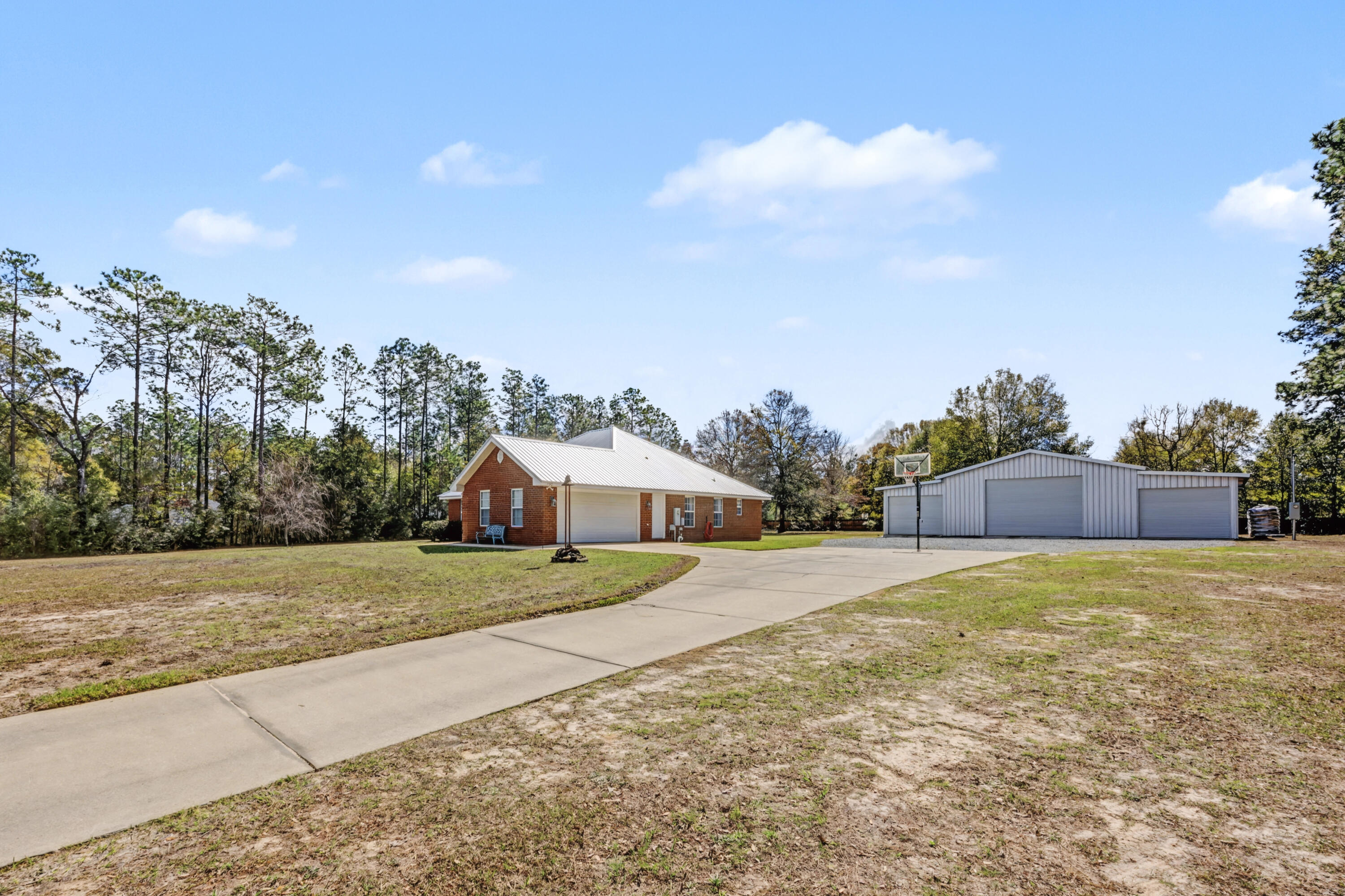 1582 Greenwood Road Baker, FL 32531 - Photo 40 of 49 a view of an house with backyard and trees