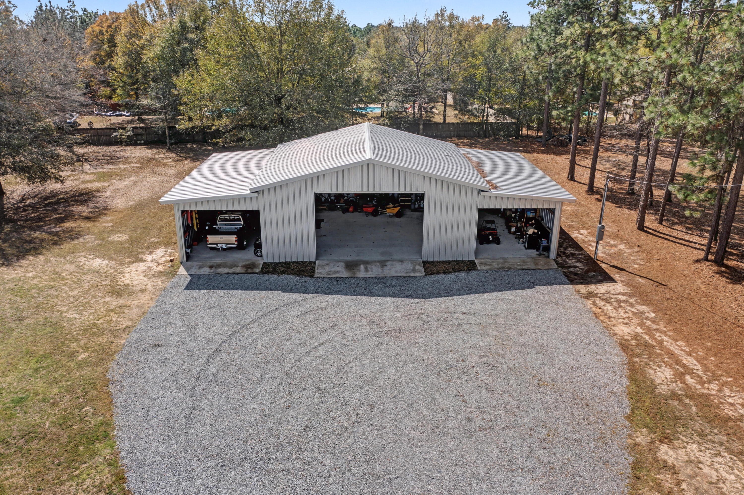 1582 Greenwood Road Baker, FL 32531 - Photo 42 of 49 a view of a house with a yard and large tree