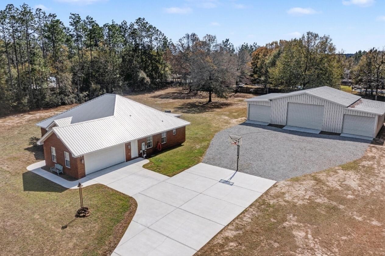 1582 Greenwood Road Baker, FL 32531 - Photo 49 of 49 a view of a white house with a outdoor space