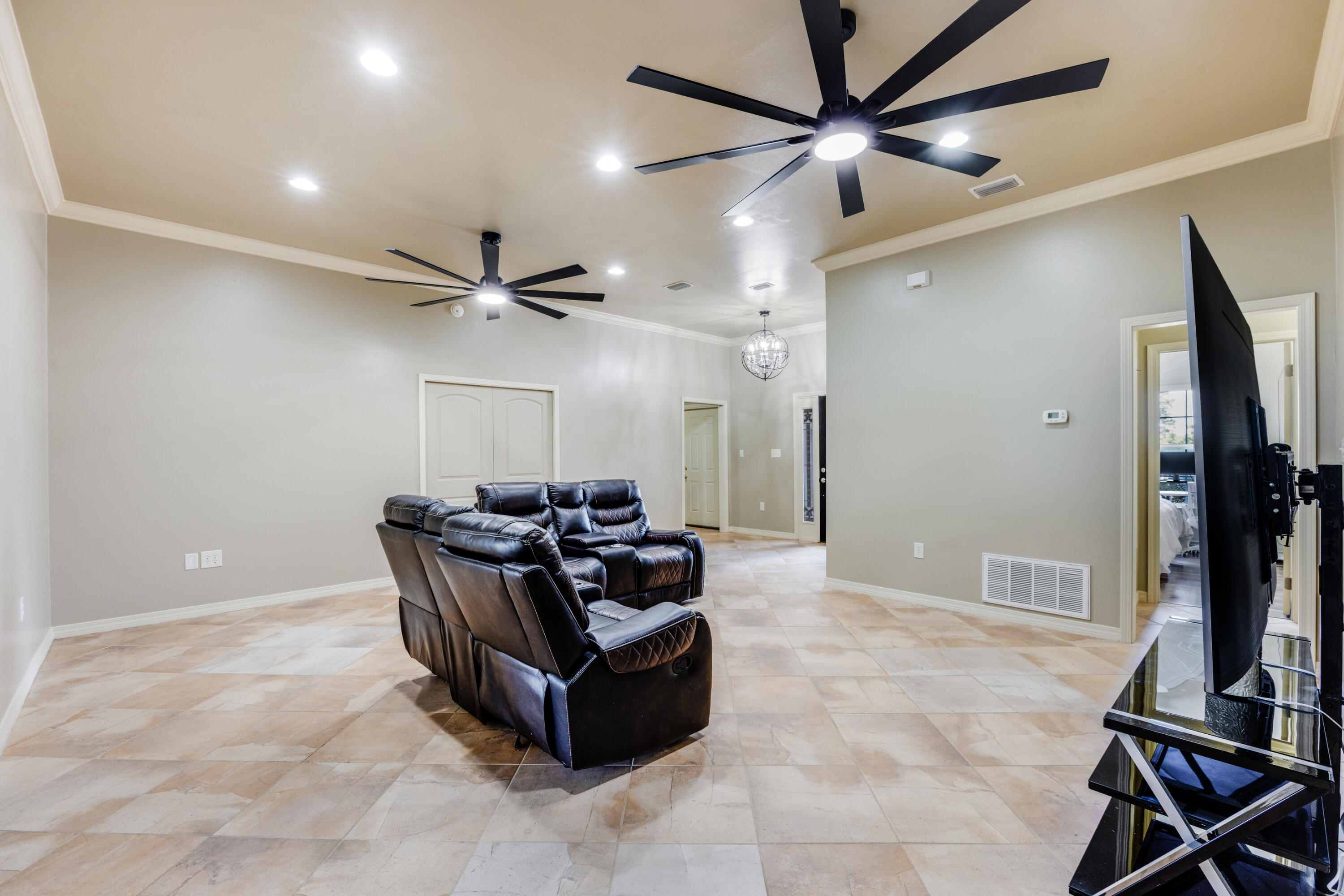 1582 Greenwood Road Baker, FL 32531 - Photo 8 of 49 a living room with furniture a ceiling fan and a rug