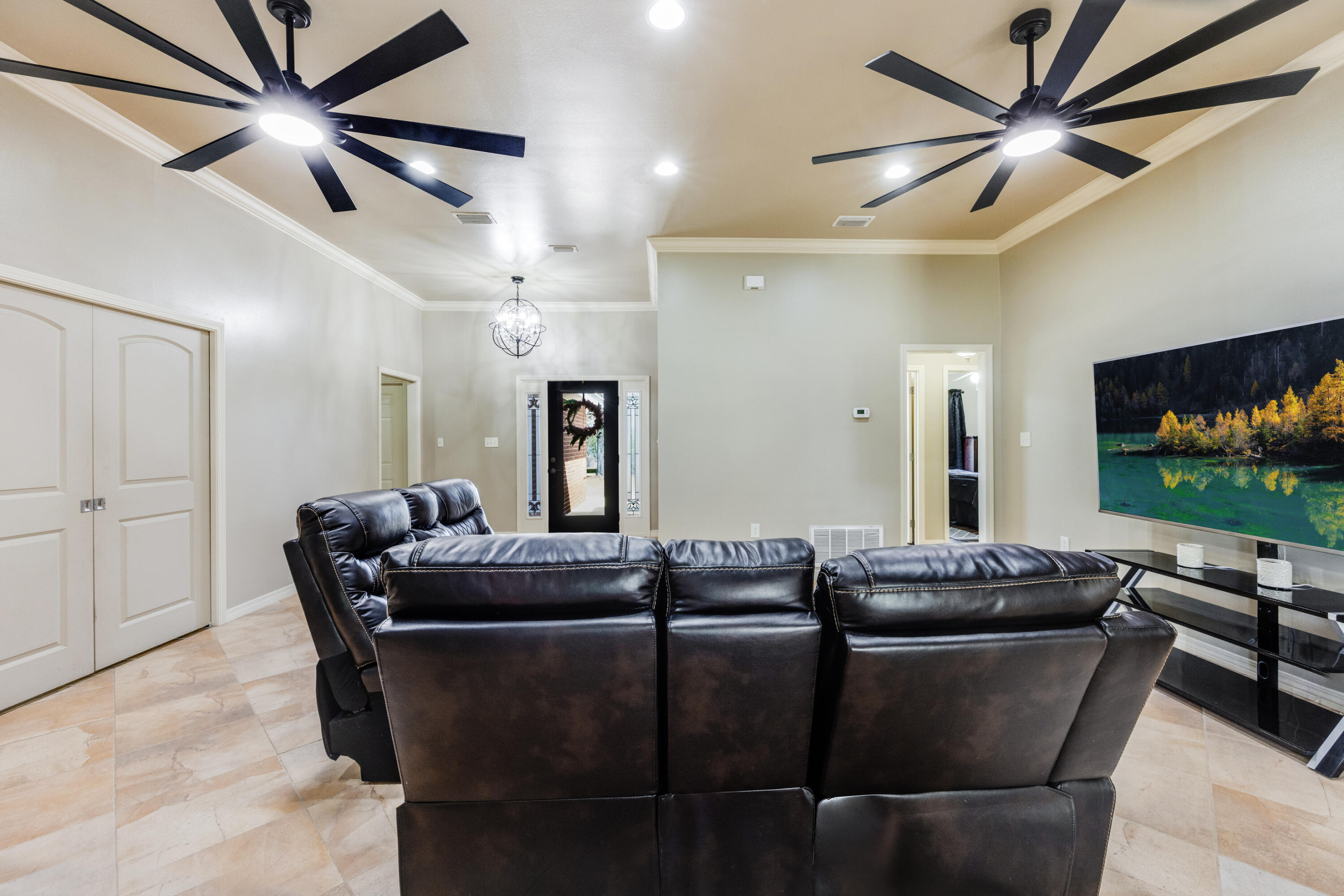 1582 Greenwood Road Baker, FL 32531 - Photo 10 of 49 a living room with furniture and a flat screen tv
