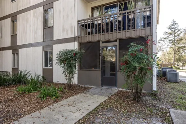 a view of front of house with potted plants