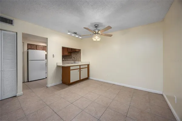 a kitchen with cabinets and stainless steel appliances
