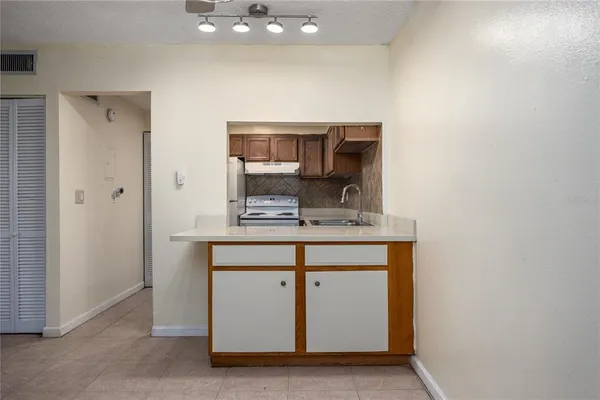 a room with sink and mirror