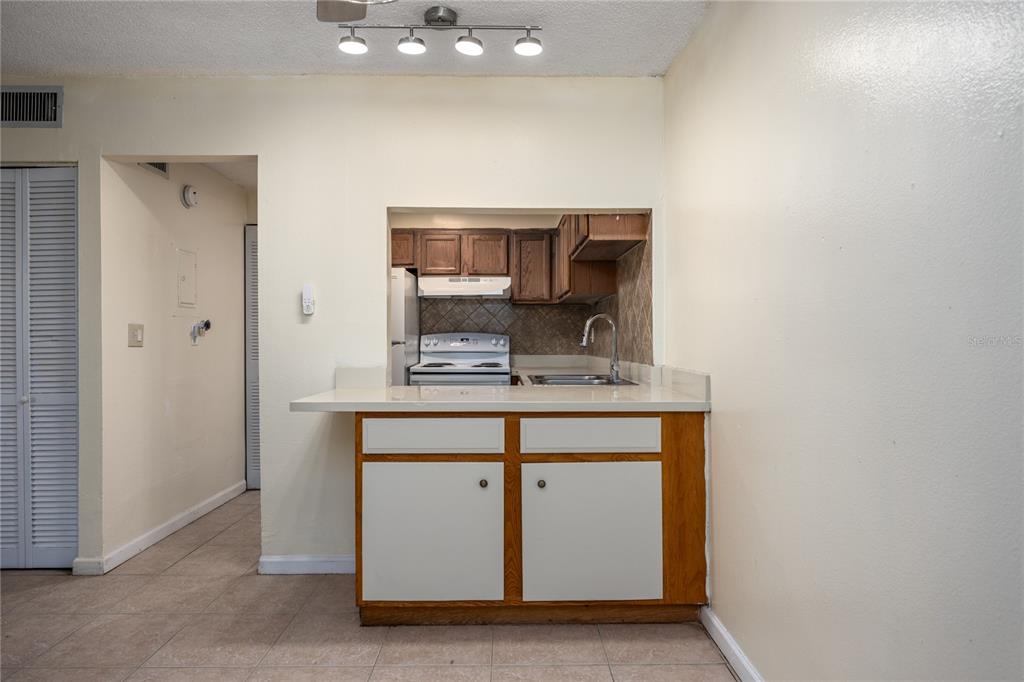 6519 West Newberry Road, Unit 1004 Gainesville, FL 32605 - Photo 6 of 17 a room with sink and mirror
