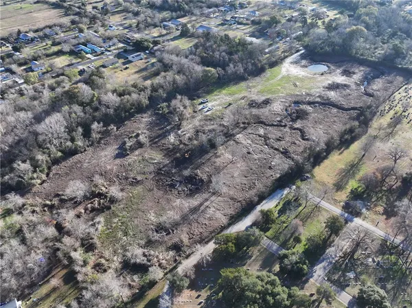 a aerial view of a house with a yard