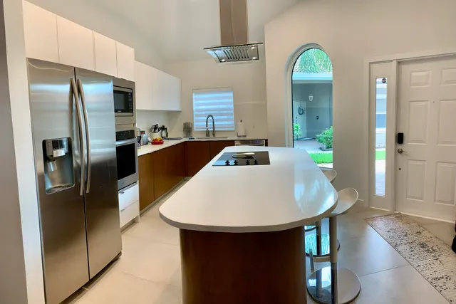 a kitchen with refrigerator and countertop