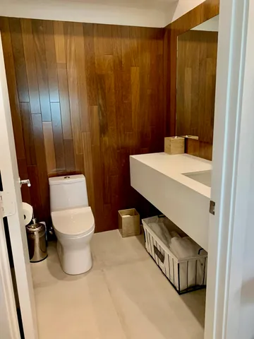 a bathroom with a sink a toilet and a shower