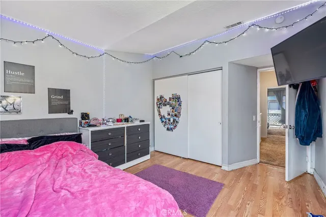 a bedroom with a bed and a dresser