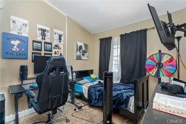 a bedroom with furniture and a window