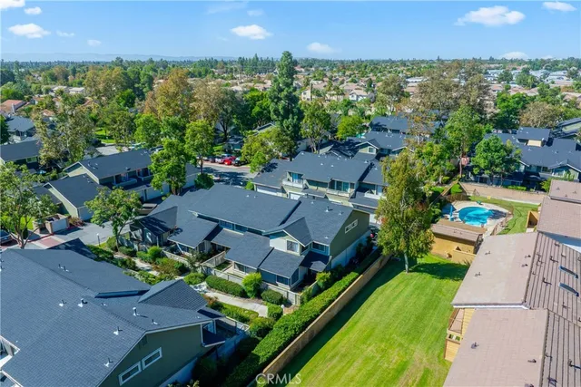 an aerial view of a house with a garden
