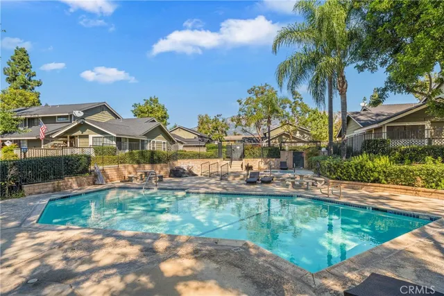an aerial view of a house with a yard and garden