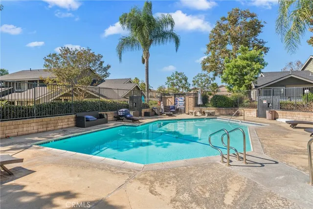 a sign that is sitting in front of flowers