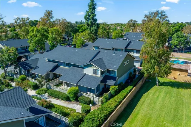 an aerial view of house with yard
