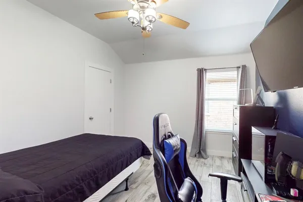 a bedroom with bed and window