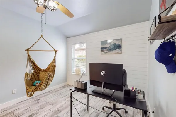 a living room with furniture and a window