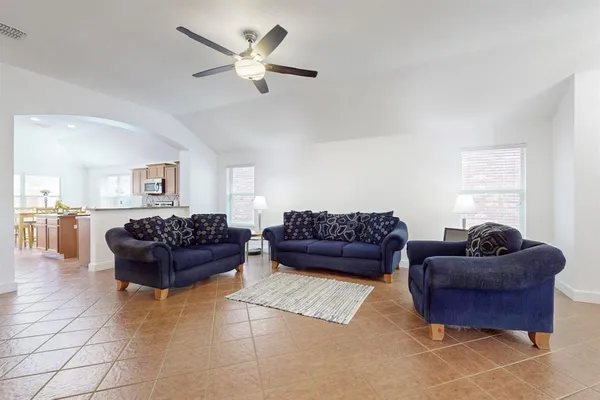 a living room with furniture and a window