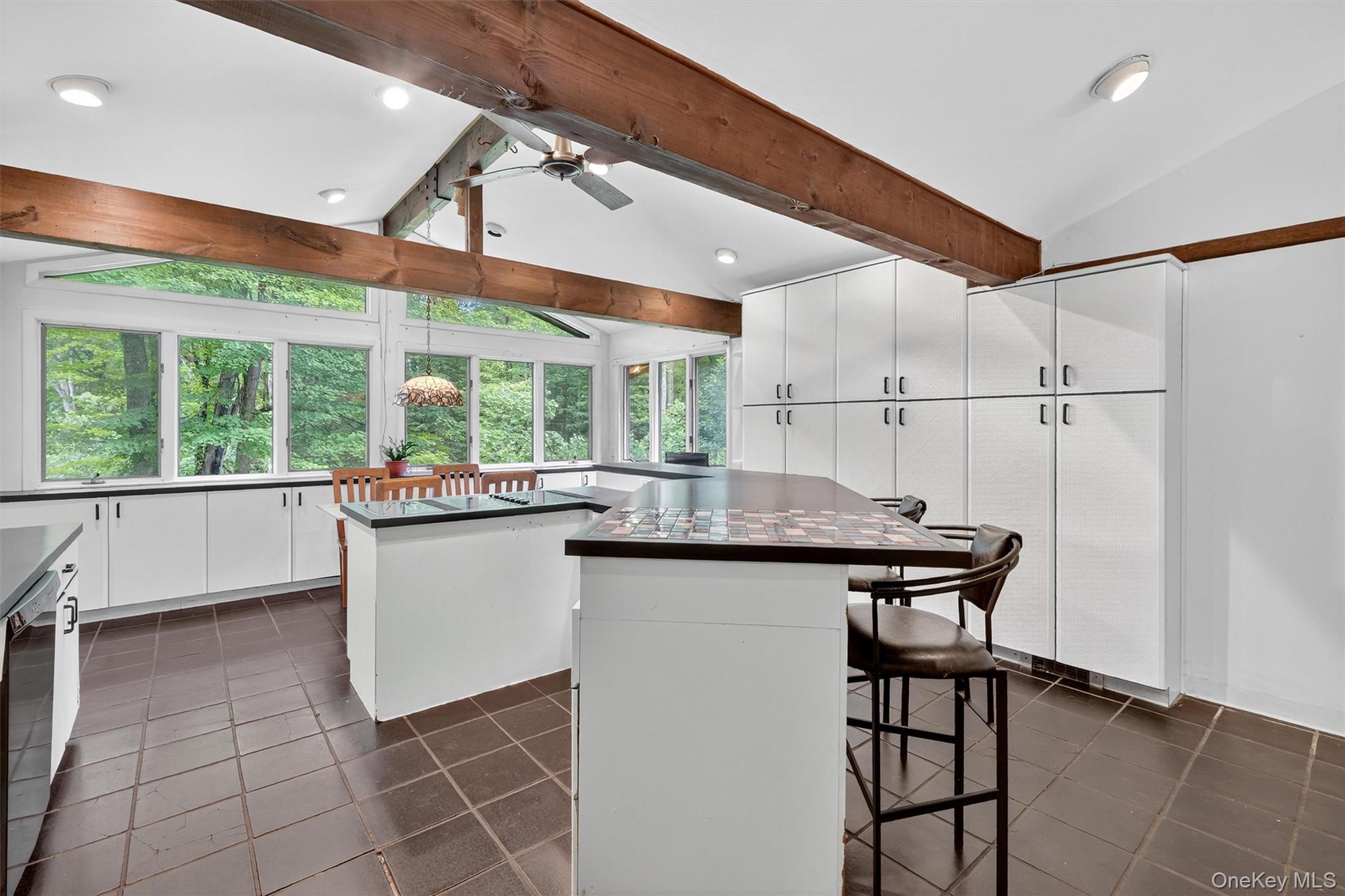 4 Cedar Hill Road Bedford, NY 10506 - Photo 14 of 50 a kitchen with kitchen island a large window in it and kitchen island