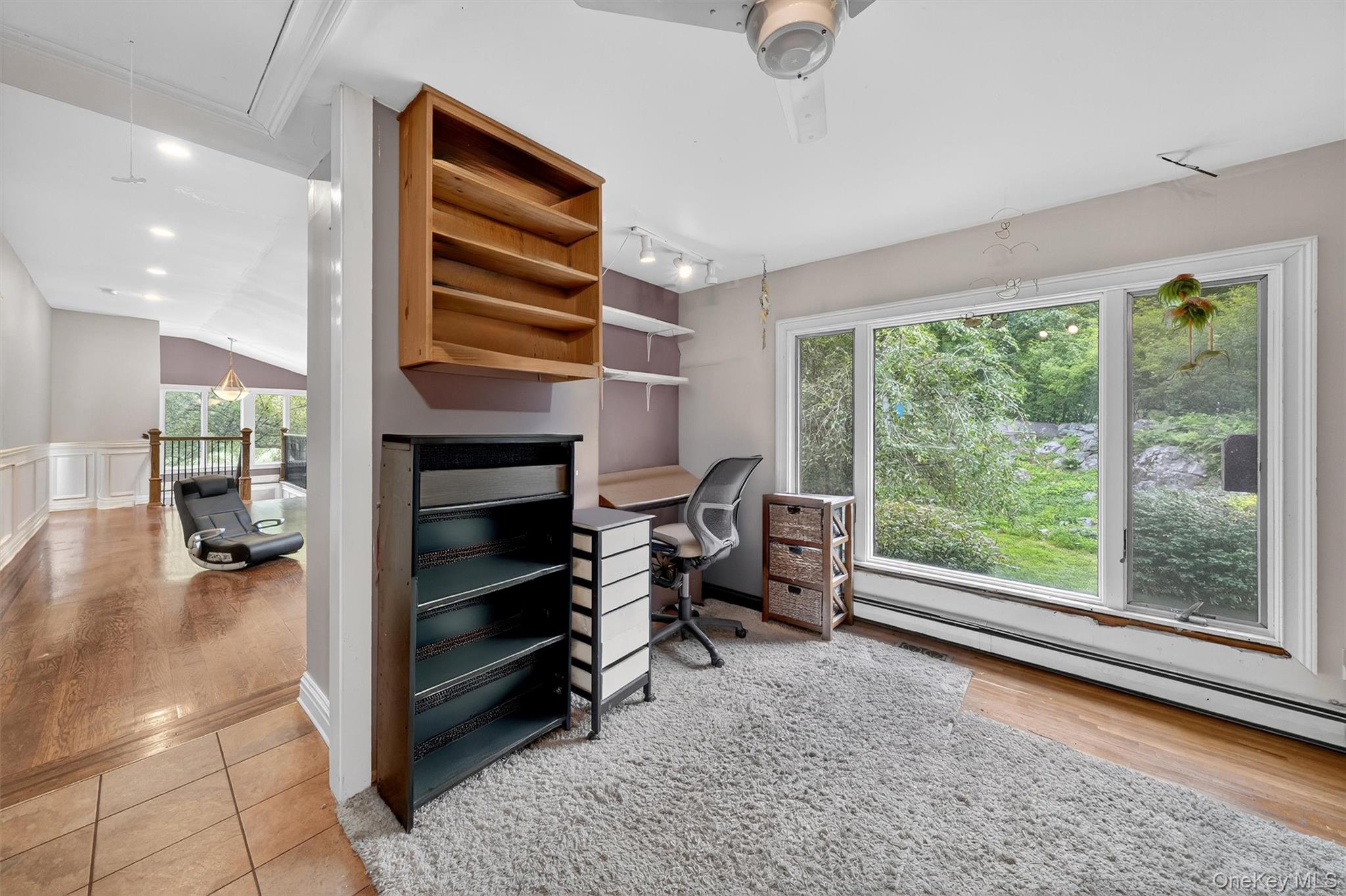 4 Cedar Hill Road Bedford, NY 10506 - Photo 20 of 50 a view of a livingroom with furniture and a ceiling fan