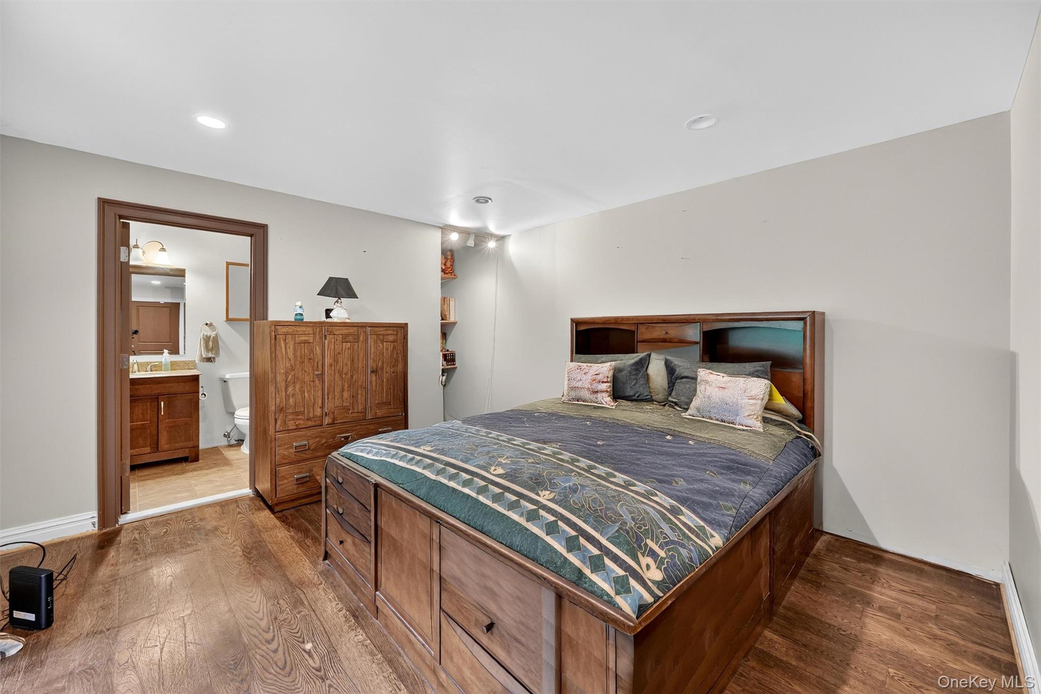 4 Cedar Hill Road Bedford, NY 10506 - Photo 22 of 50 a bedroom with a bed and wooden floor