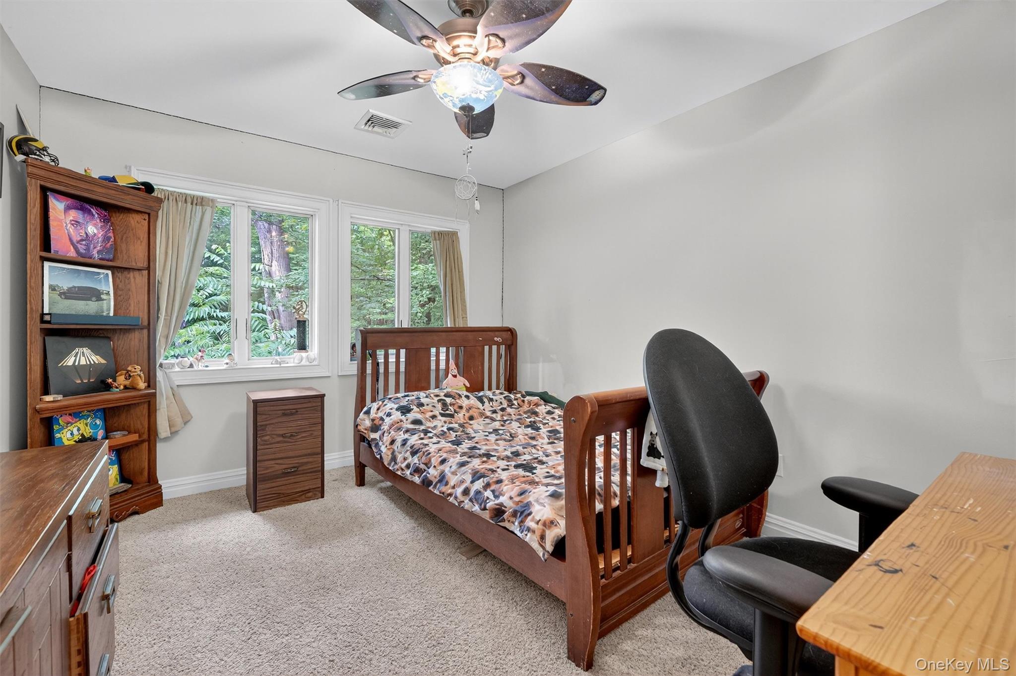 4 Cedar Hill Road Bedford, NY 10506 - Photo 30 of 50 a bedroom with a bed and a chandelier