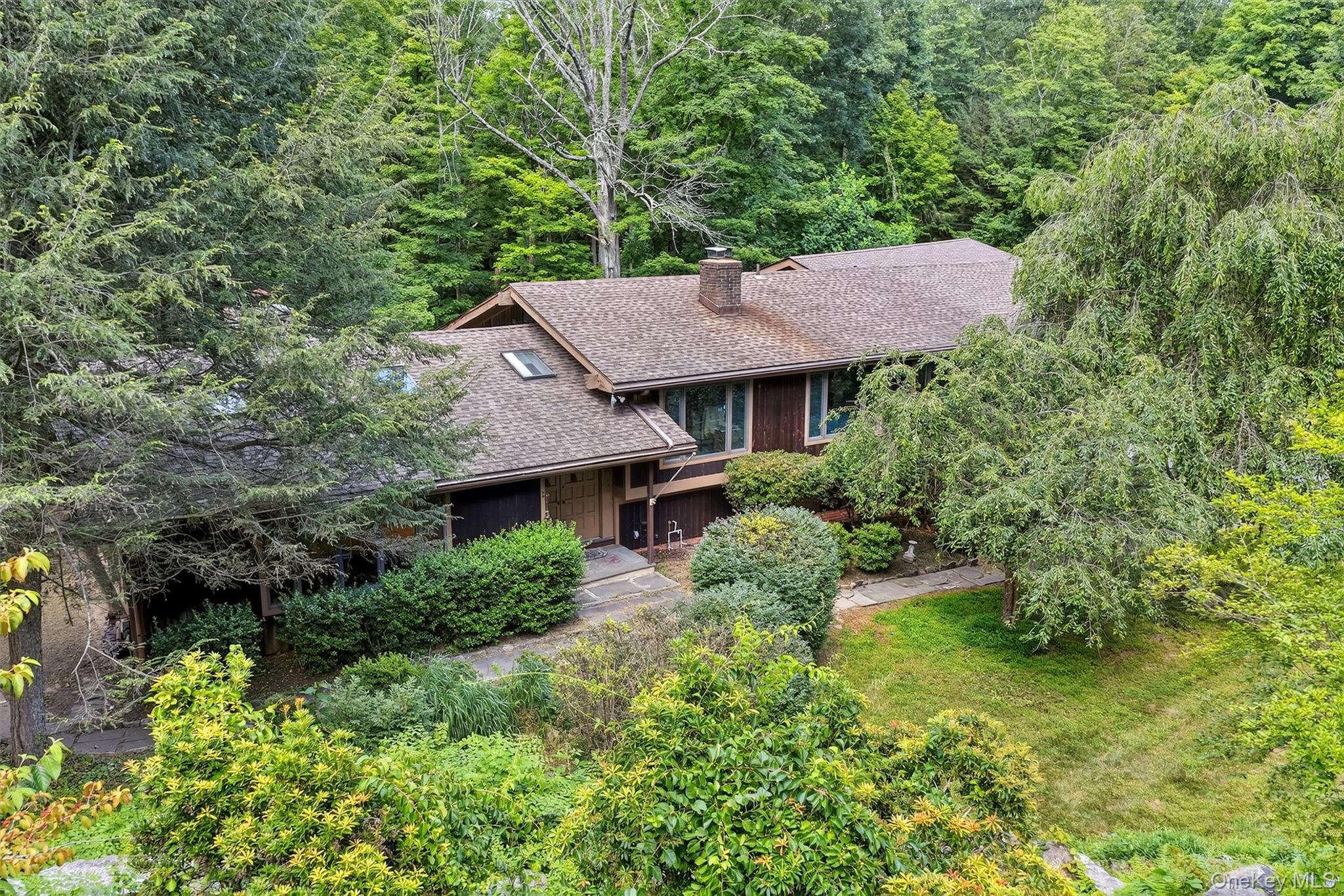 4 Cedar Hill Road Bedford, NY 10506 - Photo 3 of 50 a view of a house with a yard plants and large tree
