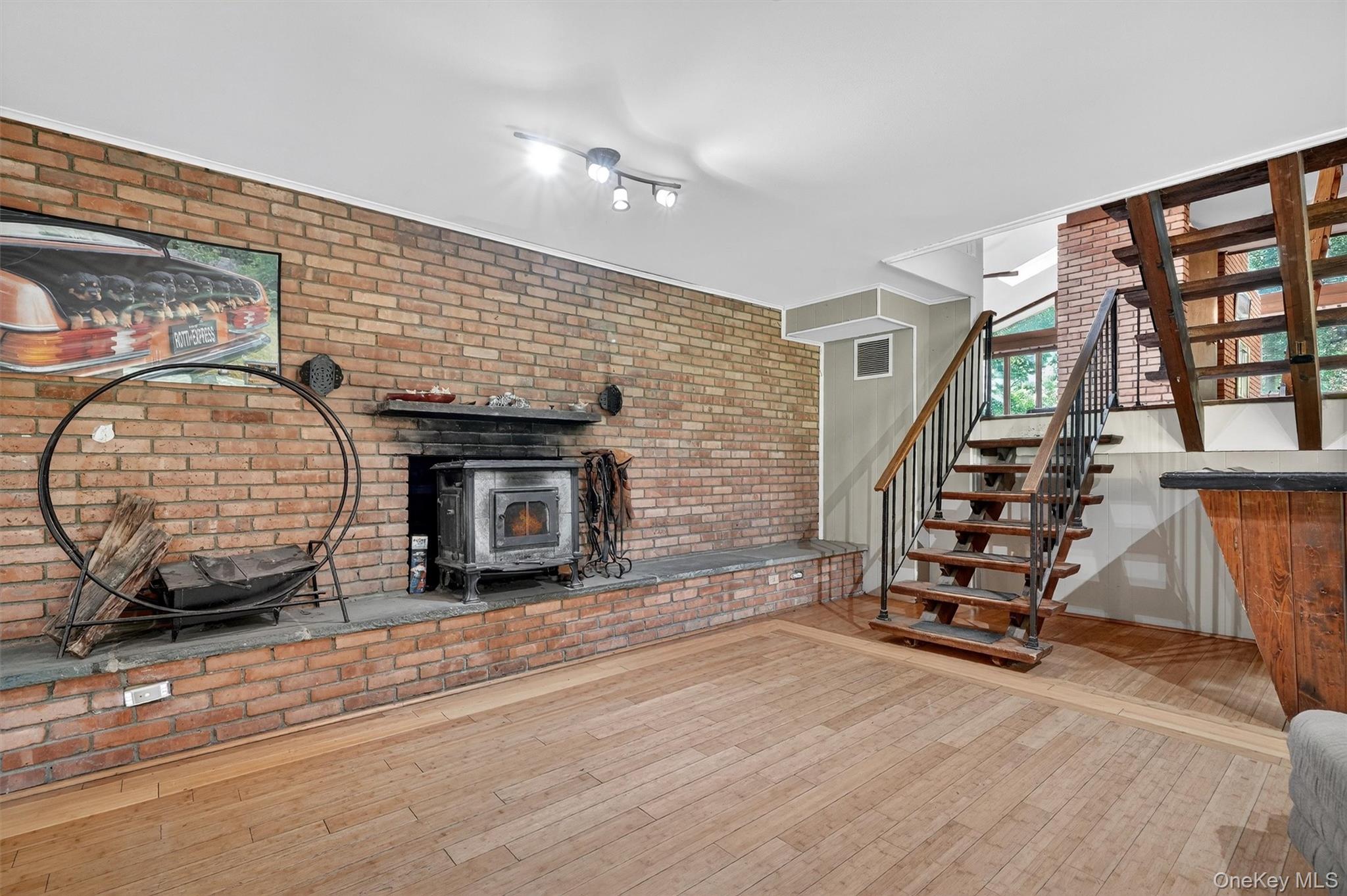 4 Cedar Hill Road Bedford, NY 10506 - Photo 35 of 50 an empty room with wooden floor and windows