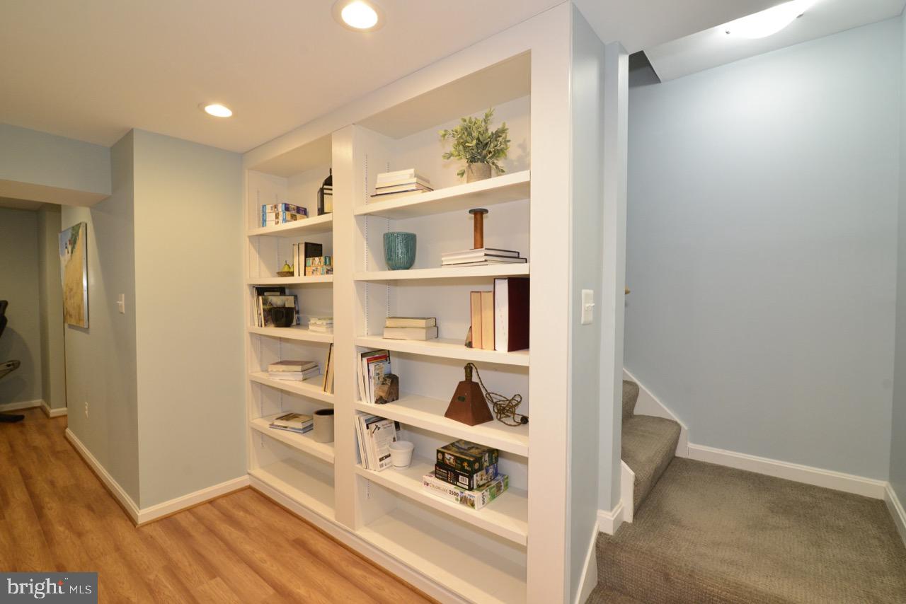 13366 Point Rider Lane Herndon, VA 20171 - Photo 23 of 40 Lower Level Landing with Built-in Shelving