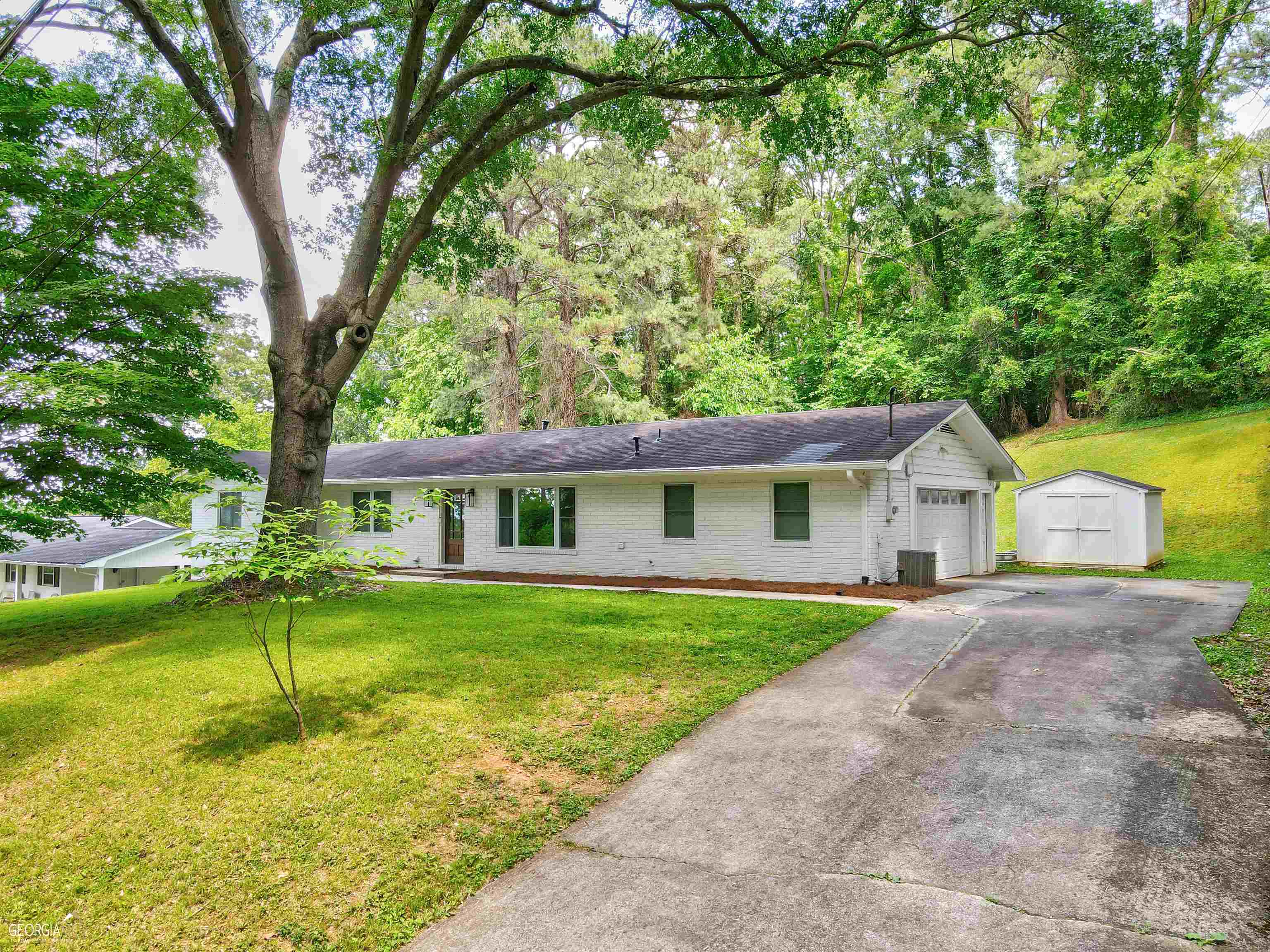 1105 Collinwood Road Rome, GA 30161 - Photo 1 of 1 front view of a house with a yard