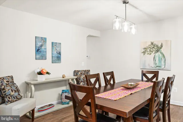a kitchen with a sink cabinets and wooden floor