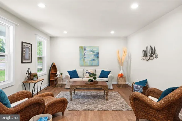 a kitchen with stainless steel appliances kitchen island granite countertop a dining table and chairs