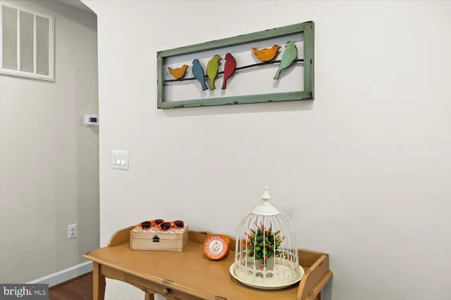 a view of room with wooden floor and closet