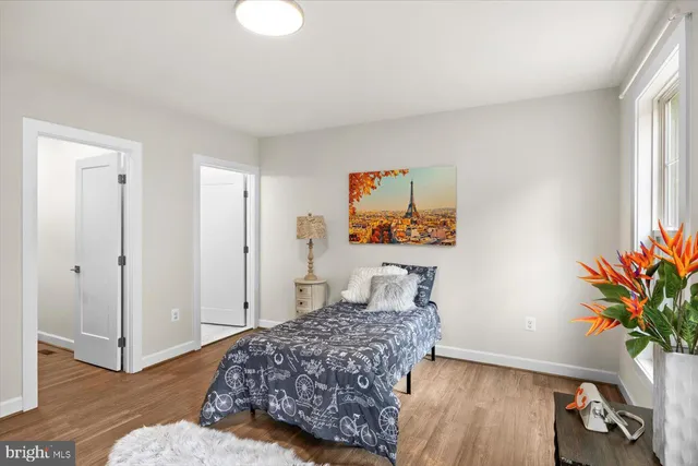 an aerial view of a house with a garden and lake view